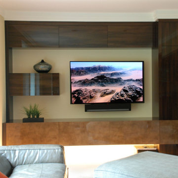 Floating entertainment center in family room directly off of kitchen