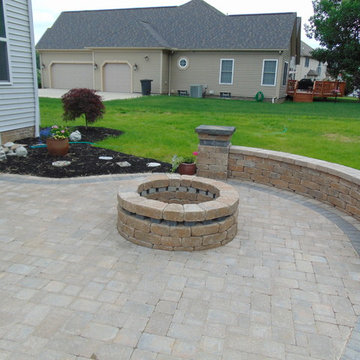 Patio with Natural Stone Steps, Seating Wall, and low voltage lighting