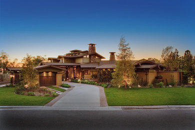 Huge craftsman brown two-story mixed siding exterior home idea in Orange County with a shingle roof