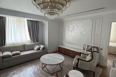 Photo of an expansive modern living room in London with carpet, a standard fireplace and a wooden fireplace surround.