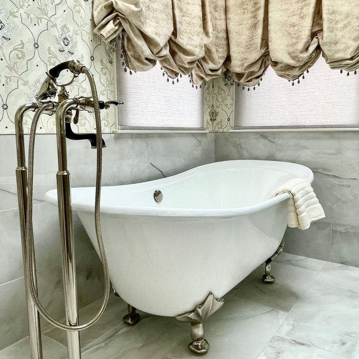 Porcelain floor & wall tile, freestanding sink, custom glass shower, custom window treatment, wallpaper, granite counter top, custom vanity
