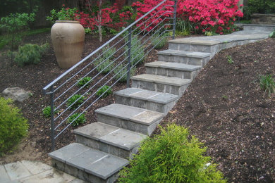 Design ideas for a mid-sized traditional partial sun front yard stone garden path in DC Metro for spring.
