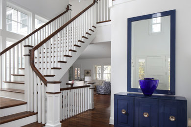 Inspiration for a beach style entrance in Milwaukee with medium hardwood flooring.
