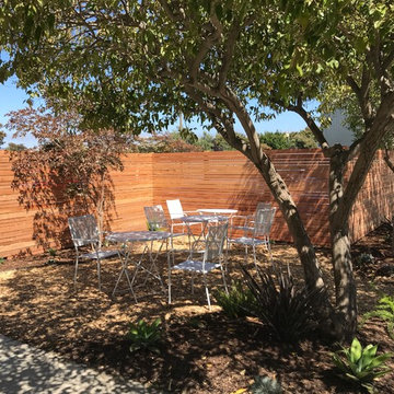 Modern redwood perimeter fence in this California Fresh Air Breakroom