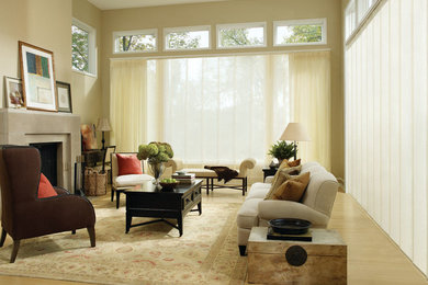Inspiration for a mid-sized timeless formal and enclosed light wood floor living room remodel in Phoenix with beige walls, a standard fireplace, a concrete fireplace and no tv