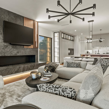 Modern Luxury Lakehouse Open-Concept Living Room with Sleek Fireplace and Adjace