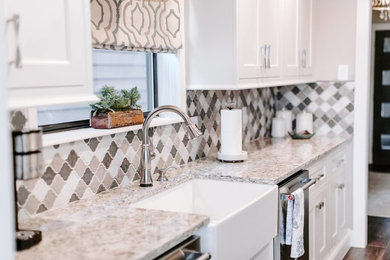 Example of a mid-sized transitional galley dark wood floor and brown floor eat-in kitchen design in Little Rock with a farmhouse sink, recessed-panel cabinets, white cabinets, granite countertops, stainless steel appliances, no island and gray countertops