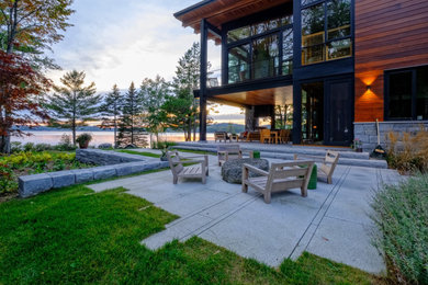 Photo of a modern backyard stone landscaping in Boston.