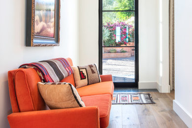 Inspiration for a transitional medium tone wood floor hallway remodel in Phoenix