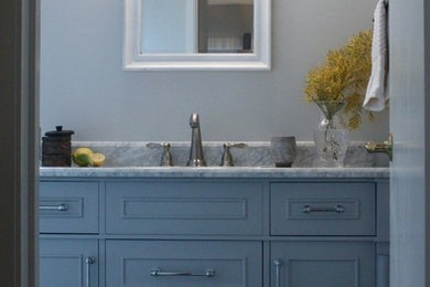 Design ideas for a small eclectic bathroom in Sacramento with furniture-like cabinets, grey cabinets, an alcove tub, a shower/bathtub combo, a two-piece toilet, white tile, ceramic tile, grey walls, vinyl floors, an undermount sink, marble benchtops, multi-coloured floor, a shower curtain and grey benchtops.