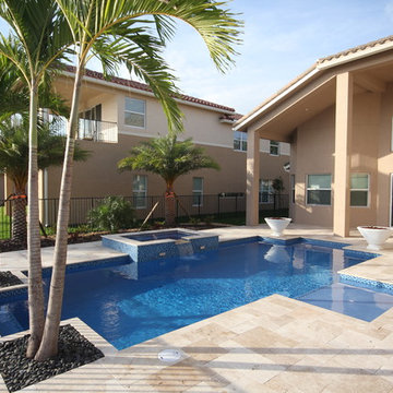 Custom Pool & Spa with Partially Raised Spa, and Fire Bowls in Boynton Beach
