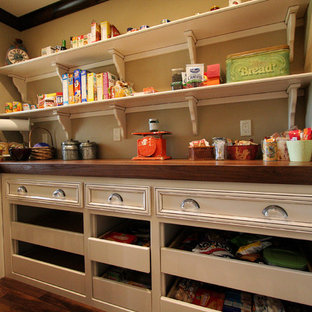 Traditional kitchen pantry remodeling - Inspiration for a timeless medium tone wood floor kitchen pantry remodel in Kansas City with open cabinets, white cabinets and wood countertops