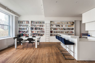 Example of a trendy kitchen/dining room combo design in New York with white walls