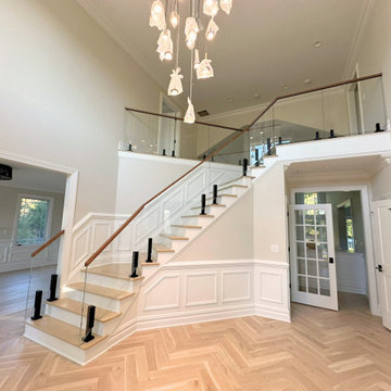 Foyer Staircase with Glass Rail & Herringbone