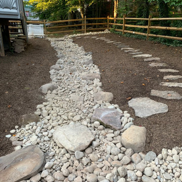 The dry creek is ready for a heavy rainfall.