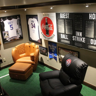 This is an example of a large bohemian basement in Oklahoma City with grey walls, carpet and green floors.