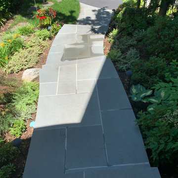 Walkway, retaining walls, plantings and stone stairs and front stoop