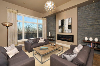 Transitional formal open concept living room in Edmonton with beige walls, light hardwood floors, a ribbon fireplace, a stone fireplace surround and no tv.