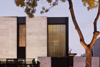 Photo of a large modern two-storey grey house exterior in Melbourne.