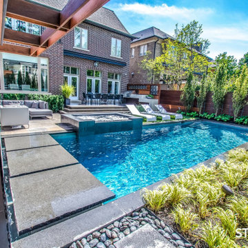 Modern Style Outdoor Pool and Lounge Seating Using New Ebony Granite