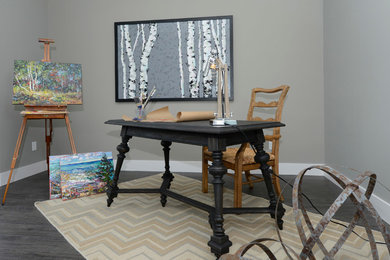 Inspiration for a mid-sized transitional freestanding desk dark wood floor and brown floor study room remodel in Other with gray walls