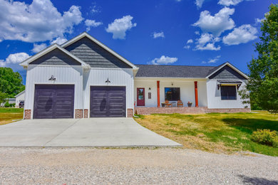 Example of a farmhouse exterior home design in Huntington