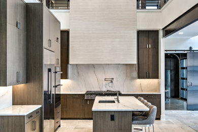 Inspiration for a contemporary l-shaped gray floor open concept kitchen remodel in Omaha with an undermount sink, flat-panel cabinets, gray cabinets, white backsplash, stone slab backsplash, stainless steel appliances, an island and white countertops