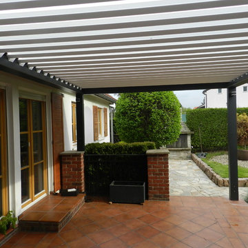 Adjustable motorized louvered pergola awnings