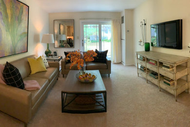 Inspiration for a small transitional enclosed carpeted and brown floor family room remodel in Philadelphia with white walls and a wall-mounted tv