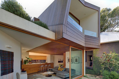 Contemporary two-storey exterior in Sydney with wood siding.