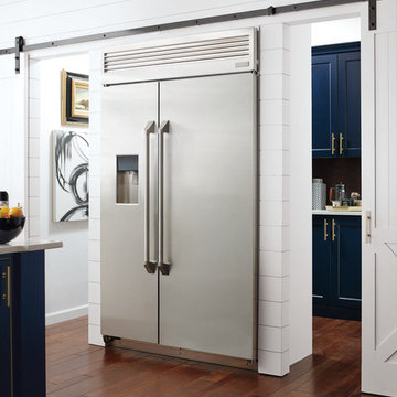 Omega Cabinetry: White Kitchen with Sliding Barn Doors
