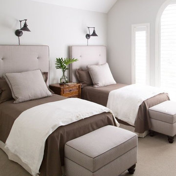 Twin Bedroom with dark brown bed sheets, white linen duvet cover.