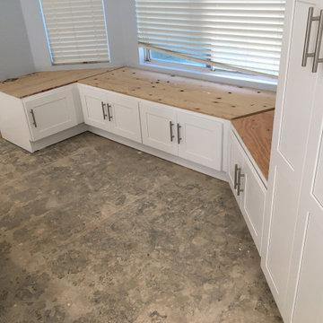 Kitchen white shaker upper cabinets and dark grey shaker base cabinets