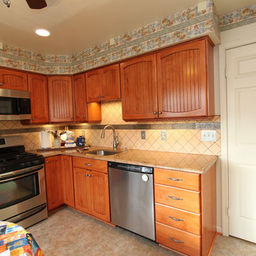Rustic Maple Kitchen with Custom Made Cabinet Doors and Granite Counters
