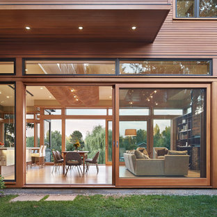 Example of a mid-sized minimalist two-story wood exterior home design in Seattle