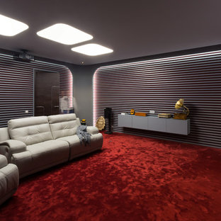 Design ideas for a contemporary home cinema in Moscow with grey walls, carpet, red floors and a projector screen.