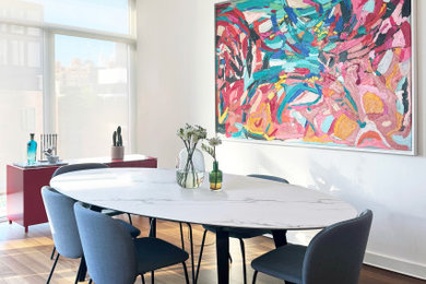 Dining room - mid-sized contemporary medium tone wood floor and brown floor dining room idea with white walls