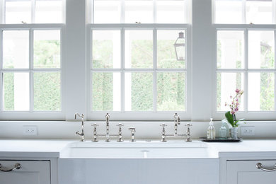 Inspiration for a large timeless u-shaped dark wood floor eat-in kitchen remodel in Houston with a farmhouse sink, light wood cabinets, white backsplash, stainless steel appliances, recessed-panel cabinets, marble countertops and an island