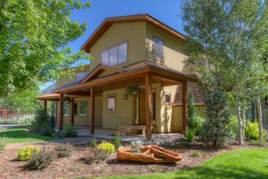 Inspiration for a beige stucco exterior home remodel in Albuquerque