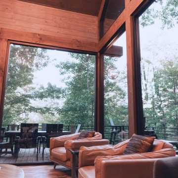 Modern Rustic Living Space with Floor-to-Ceiling Forest Views at Hidden Lake Loo
