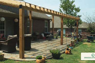 Inspiration for a large traditional partial sun backyard landscaping in Other.
