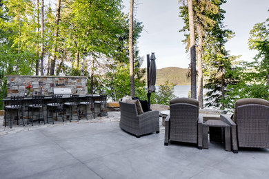 Patio kitchen - mid-sized contemporary backyard concrete patio kitchen idea in Other with no cover