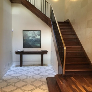 Walnut Stairs with Bronze Handrail and Iron Balusters