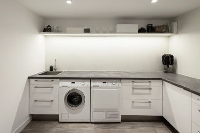 Inspiration for a modern laundry room remodel in Salt Lake City
