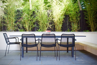 This is an example of a modern backyard patio in Cheshire.
