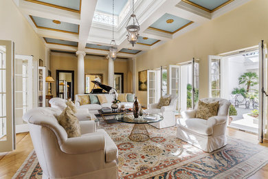 Mid-sized transitional formal and open concept light wood floor living room photo in Santa Barbara with beige walls