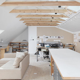 Inspiration for a large contemporary home studio in Philadelphia with white walls, plywood floors, no fireplace and a freestanding desk.