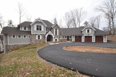 Large traditional one-story wood gable roof idea in Other