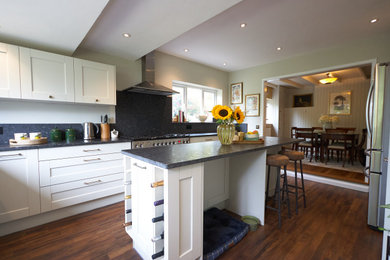 Medium sized traditional l-shaped kitchen/diner in Kent with shaker cabinets, white cabinets and an island.