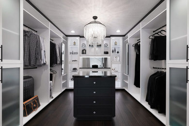 Inspiration for a modern bamboo floor and brown floor walk-in closet remodel in San Francisco with shaker cabinets and white cabinets